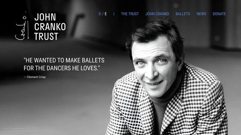 Homepage of the John Cranko Trust: a black-and-white portrait of John Cranko in a checked jacket next to the quote “He wanted to make ballets for the dancers he loves.” by Clement Crisp.