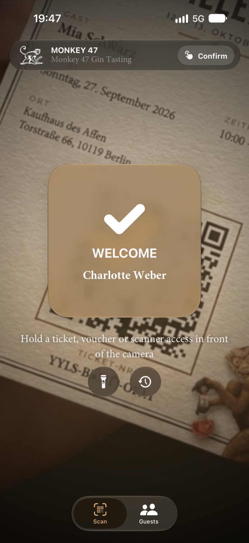 Confirmation after scanning: “Welcome Charlotte Weber” with a check mark over the ticket.